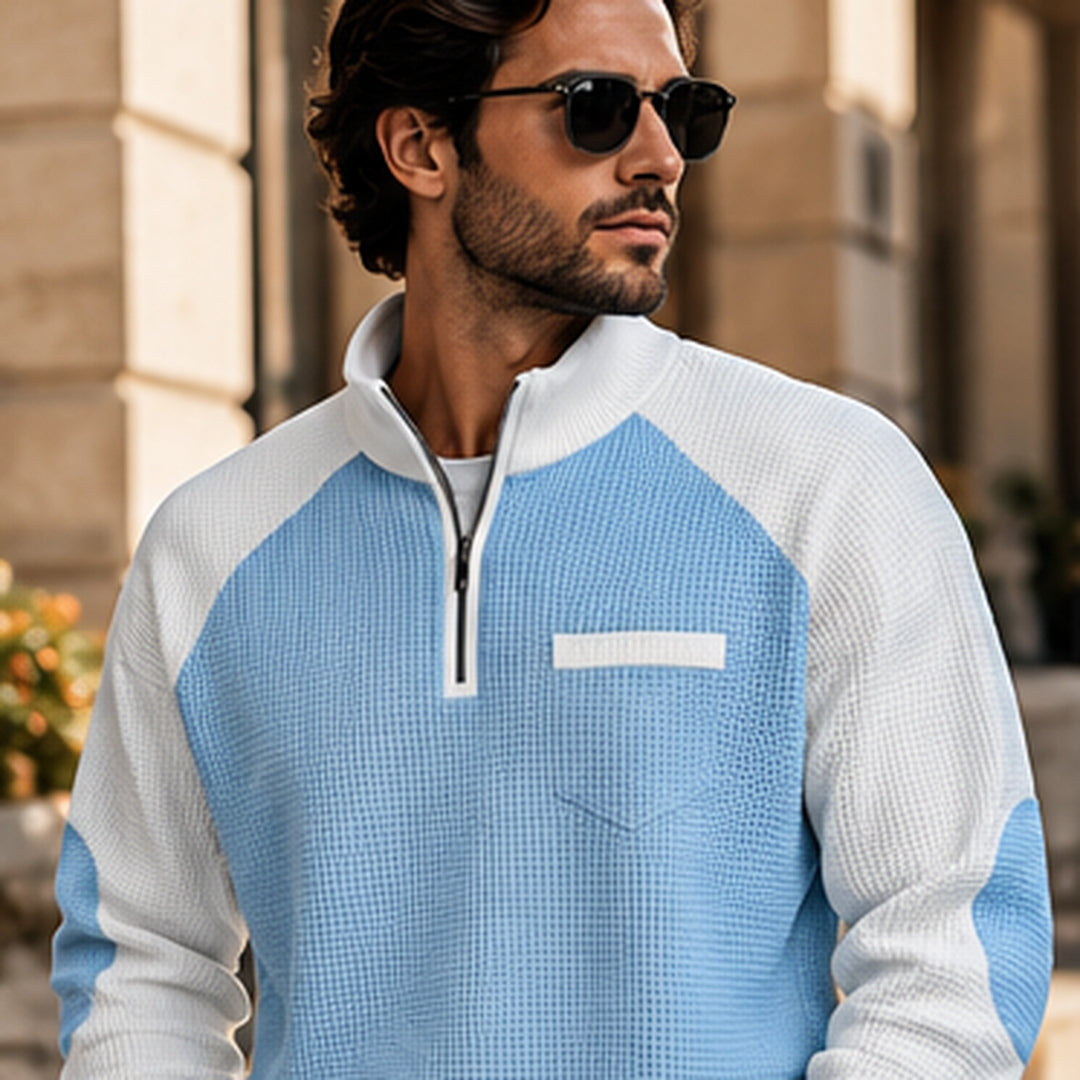 Man wearing the light blue quarter-zip pullover in the city