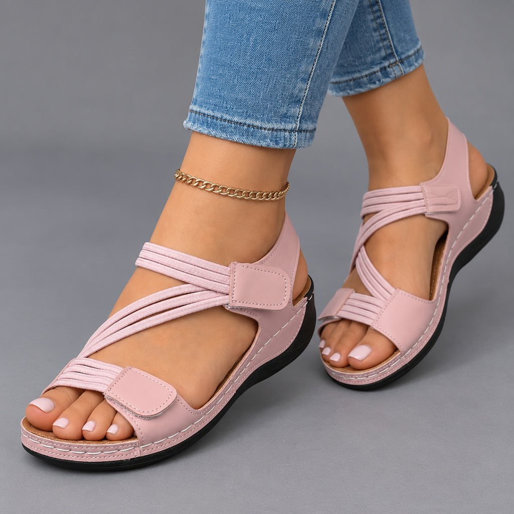 Comfort wedge sandals in pink, worn with jeans