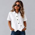 Woman wearing the white asymmetric button shirt