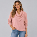 Woman wearing the blush pink cowl neck knit sweater with jeans, studio photo