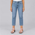 Pink comfort wedge sandals worn with cropped light jeans, studio photo